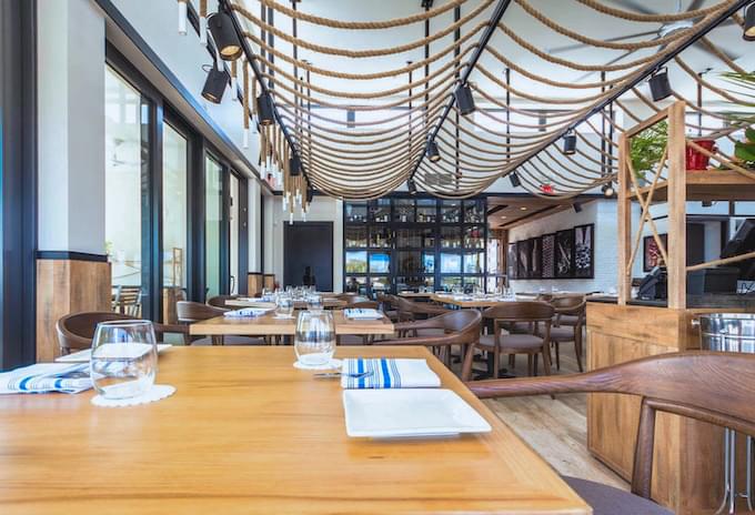 Modern interior of Bacaro restaurant with nautical-themed decor in Grand Cayman