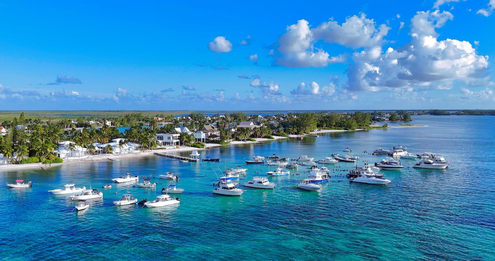 Boats anchored at Sunday Funday event at Rum Point with stunning ocean views in Grand Cayman