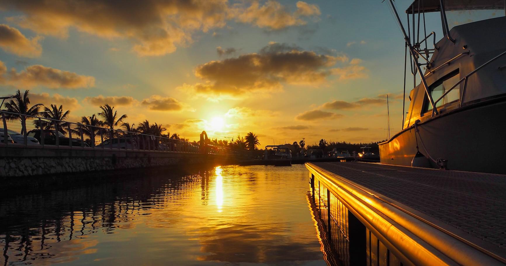 Sunset view from the marina in Grand Cayman, showcasing the vibrant sky during a sunset cruise in the Cayman Islands.