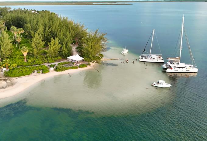 Aerial view of Starfish Point with boats docked near the shore during the best sunset cruise in Grand Cayman.