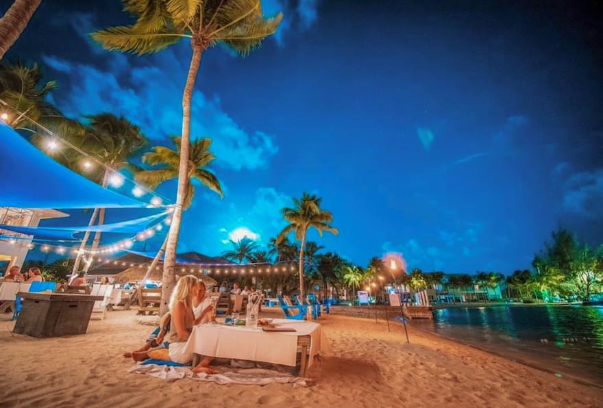 Beautiful beachside dining setup at a Grand Cayman restaurant.