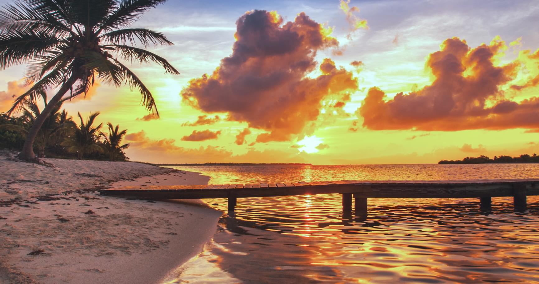 A picturesque sunset on Seven Mile Beach showcasing the island’s beauty