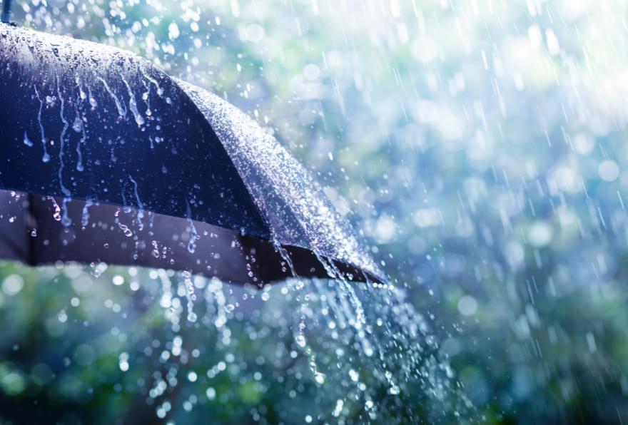 Close-up of a raindrop-covered umbrella during a brief tropical shower in George Town Cayman Islands weather