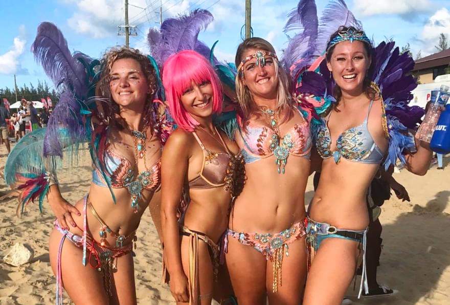 Vibrant dancers in colorful costumes celebrate at Cayman Carnival Batabano in May, the best time to visit Cayman