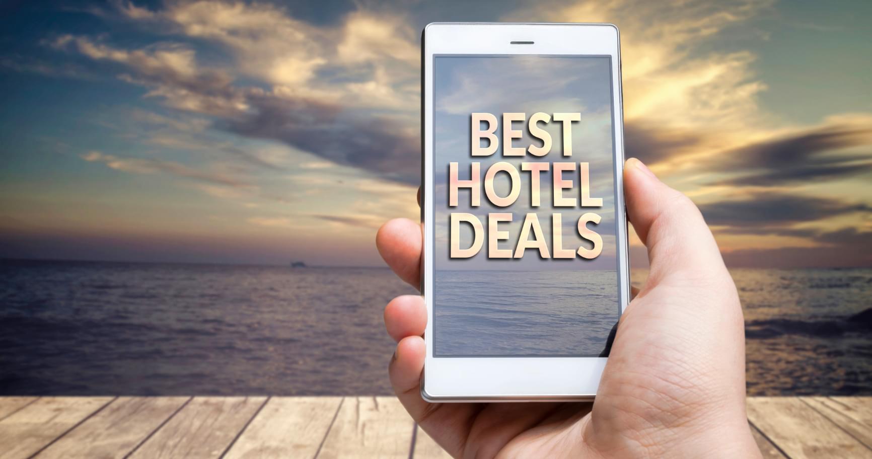 A mobile phone displaying hotel deals, highlighting affordable options during the rainy season in the Cayman Islands