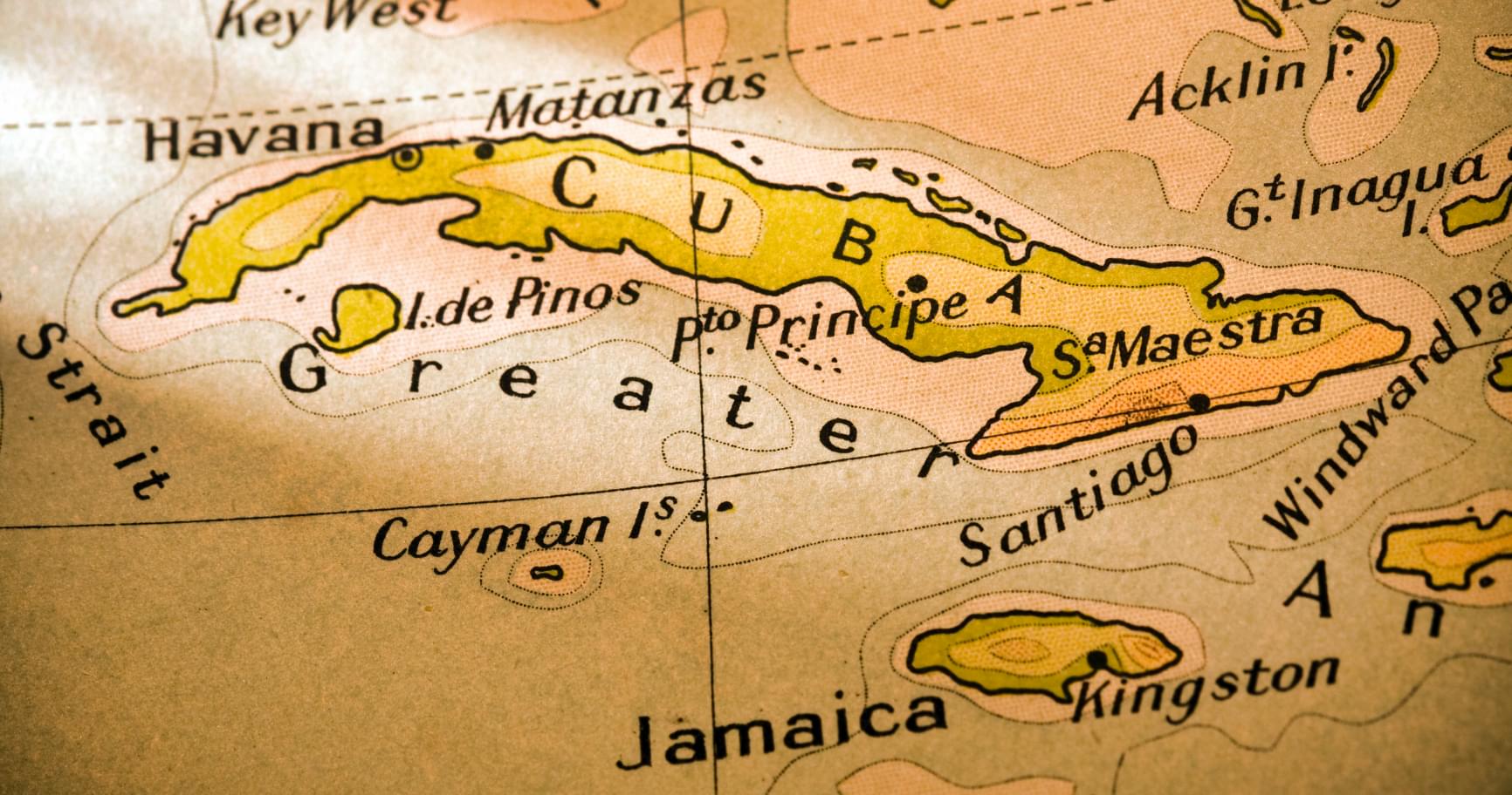 A vintage Caribbean map shows the location of the Cayman Islands on a map