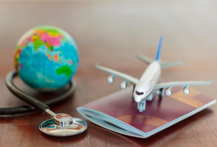 Travel essentials symbolize the excitement of planning a trip and checking the flight time to the Cayman Islands
