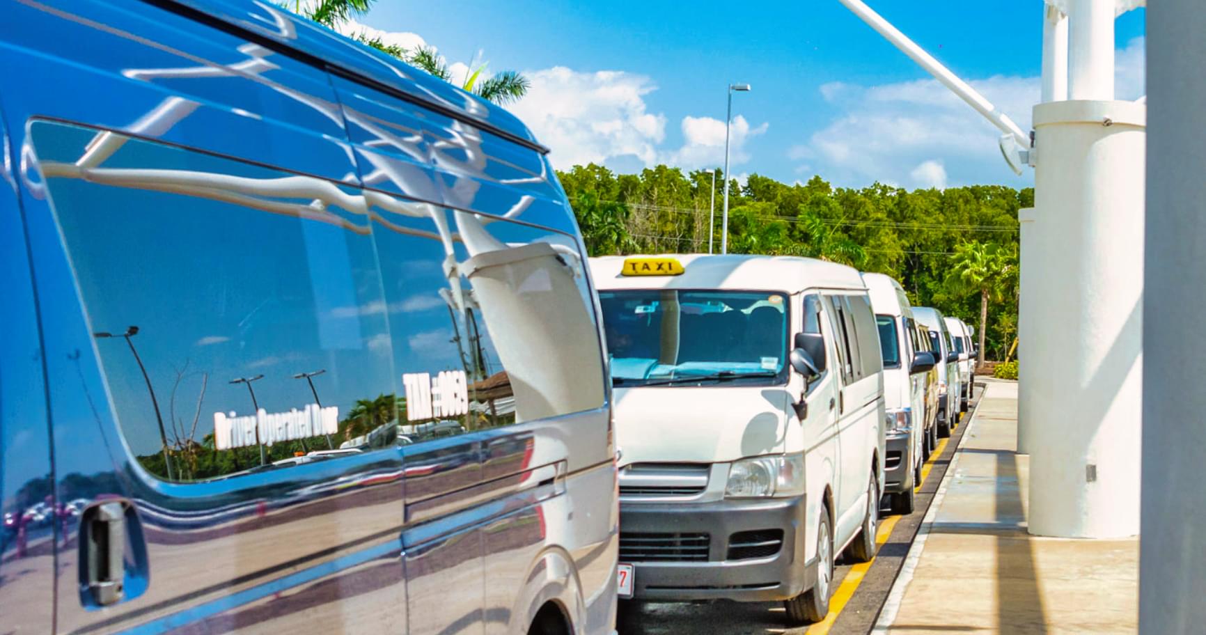 Shuttle buses outside the airport terminal, ensuring seamless and efficient Grand Cayman airport transportation
