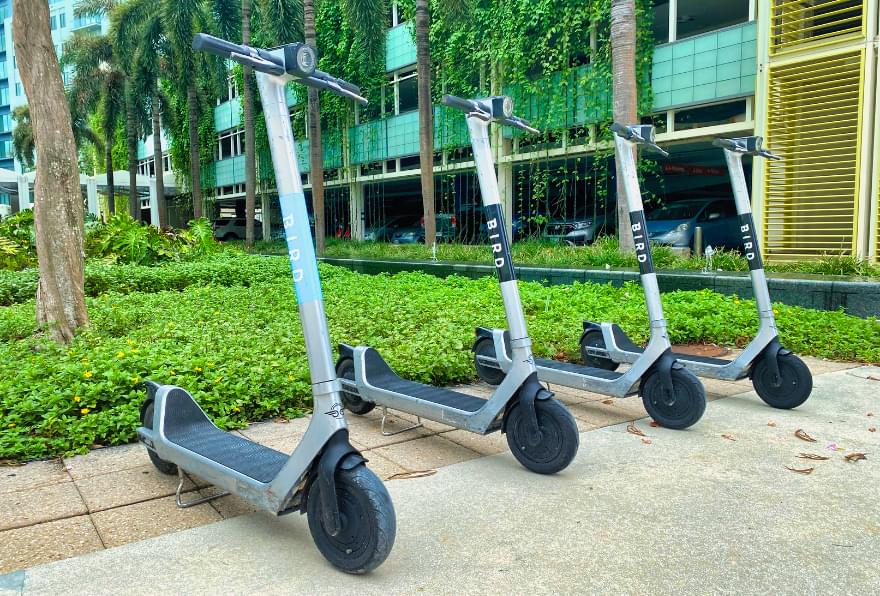 Electric scooters are neatly arranged, a sustainable and fun way to explore with electric bike rental in Grand Cayman