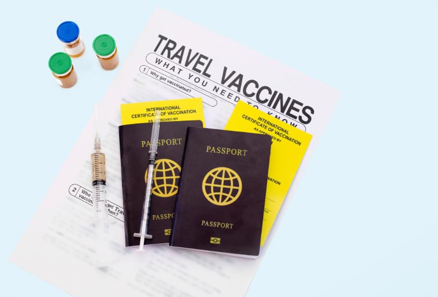 Travel vaccine booklets displayed, highlighting health considerations for entry into the Cayman Islands