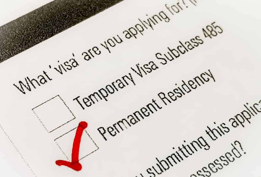 A completed immigration form showing the process for Cayman visa requirements to gain permanent residency