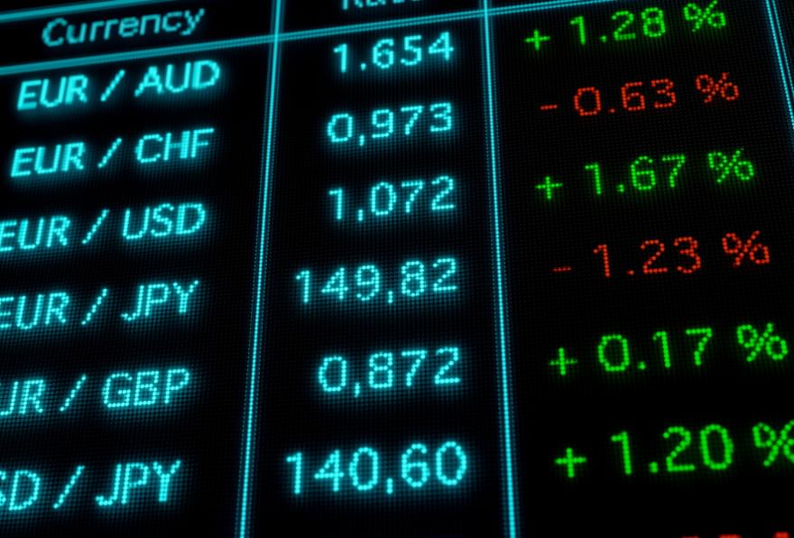 Currency exchange rates screen showing international conversions, including Cayman dollar to USD