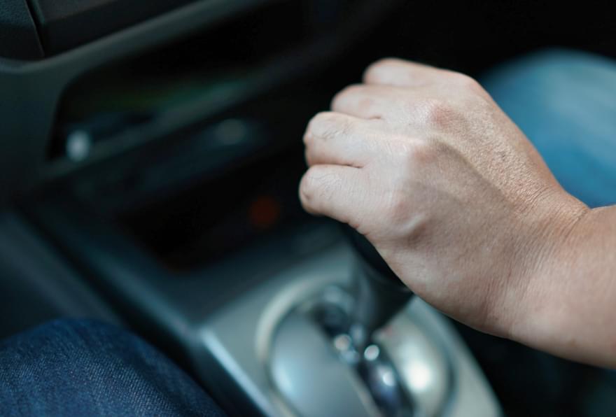 Hand-shifting gears in a rental car illustrate smooth driving