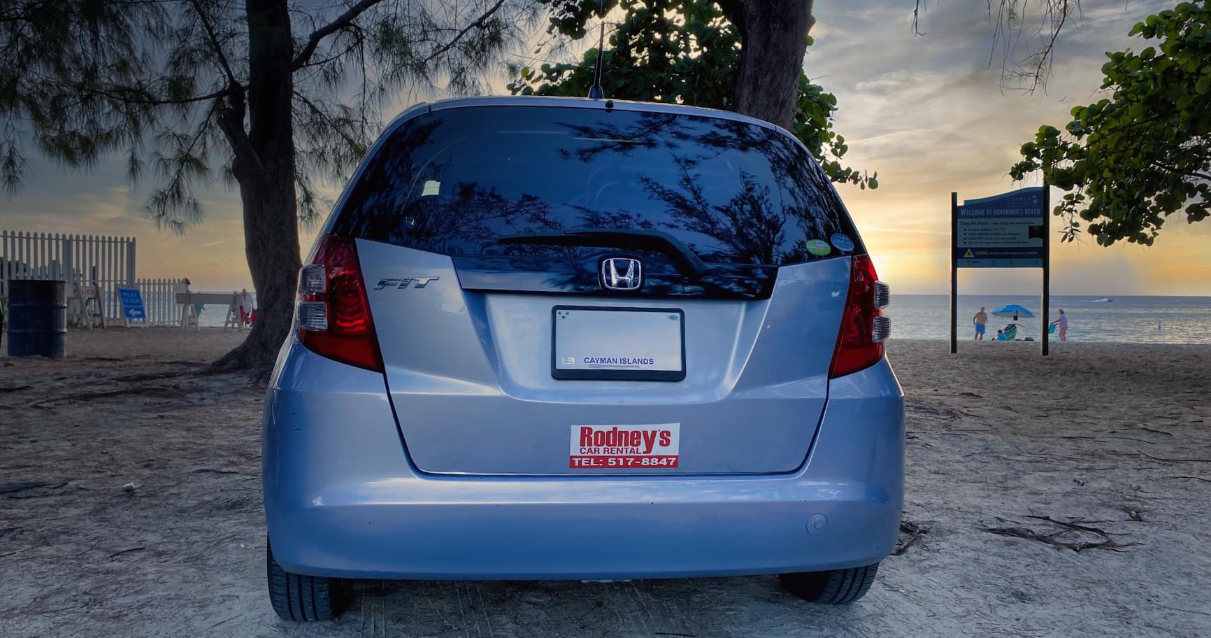 Parked car on a beachfront road in Grand Cayman, ready to explore the island.