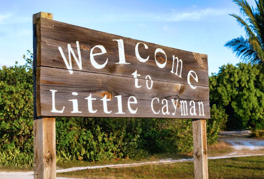 "Welcome to Little Cayman" sign, marking the entrance to a tranquil getaway.