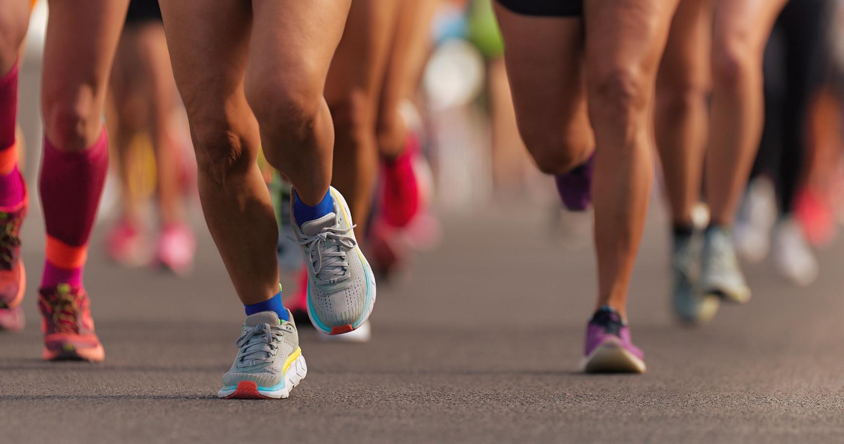Runners participating in the Cayman Islands Marathon, an exciting annual event on scenic routes.