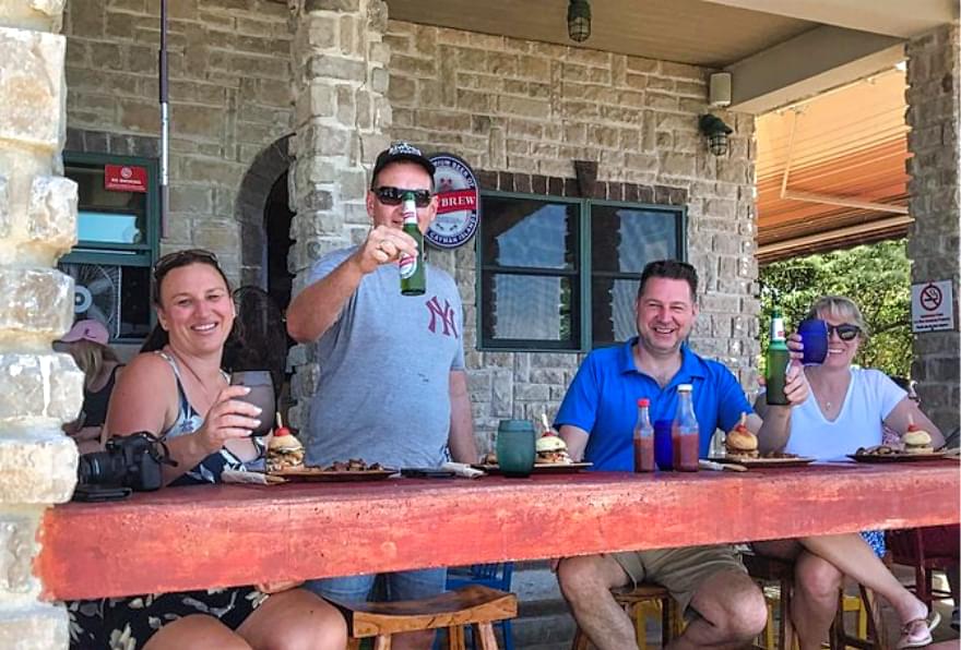 A group enjoying drinks at Vivo Cafe Grand Cayman, a local favorite.