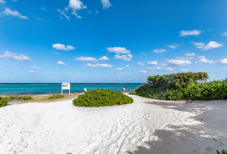 Sandy pathway leading to the famous Seven Mile Beach in Grand Cayman.