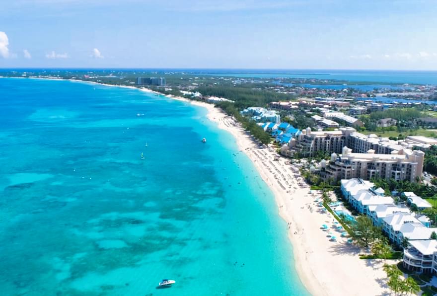 https://crystal-charter.nyc3.digitaloceanspaces.com/post/1736540299913-1.-seven-mile-beach-grand-cayman-aerial-view.jpg