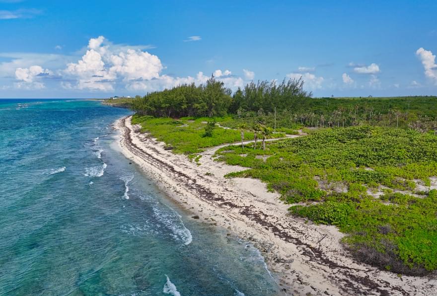 Barefoot Beach, a secluded gem on Grand Cayman’s eastern coast with pristine white sands and clear waters