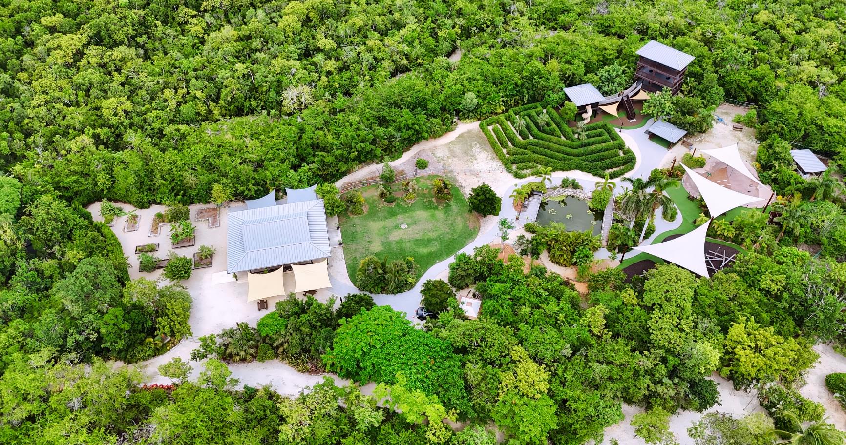 Aerial view of Queen Elizabeth II Botanic Park in Grand Cayman, showcasing its tropical flora