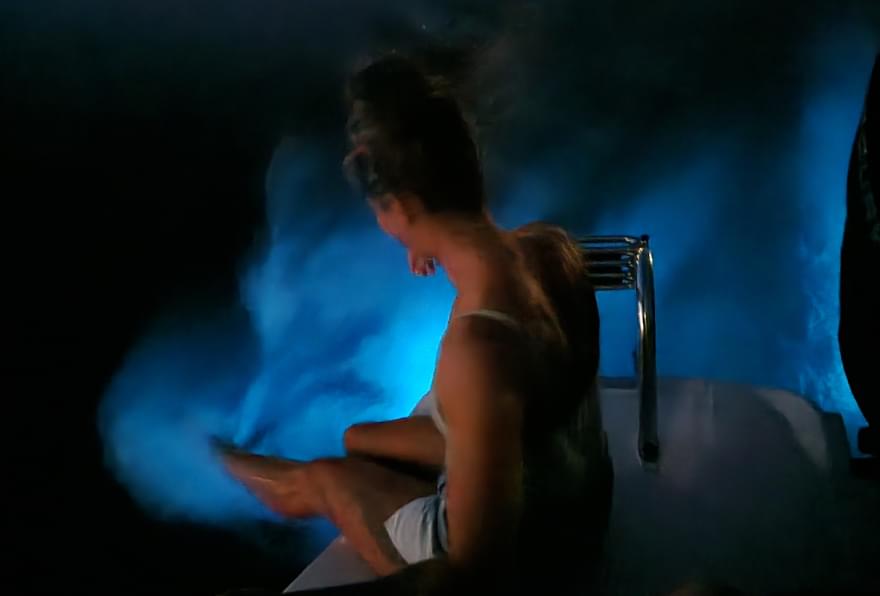 Person experiencing the magical bioluminescent waters in Grand Cayman during Grand Cayman day excursions