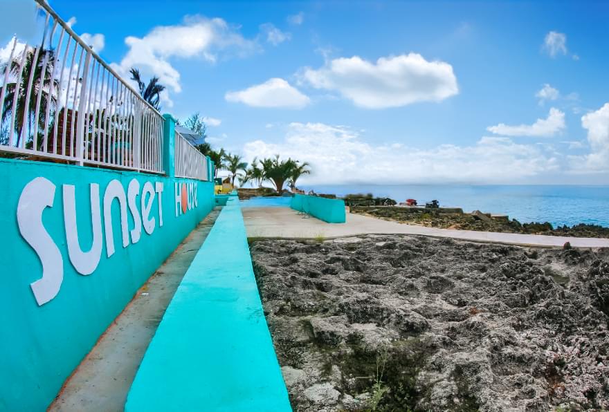 Signage at Sunset House, a top destination for Grand Cayman snorkeling excursions