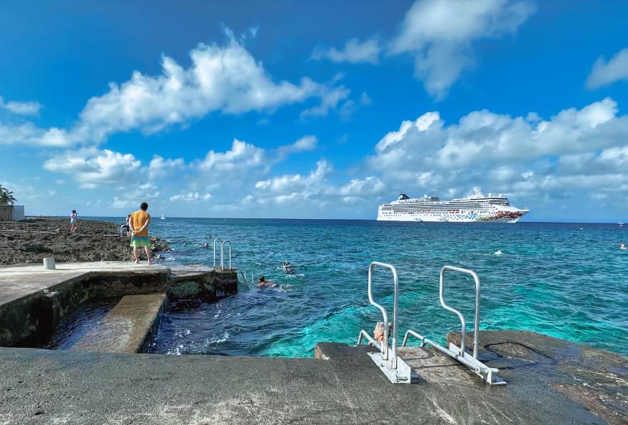 Snorkeler preparing to explore Eden Rock, a top site for cruise excursions in Grand Cayman