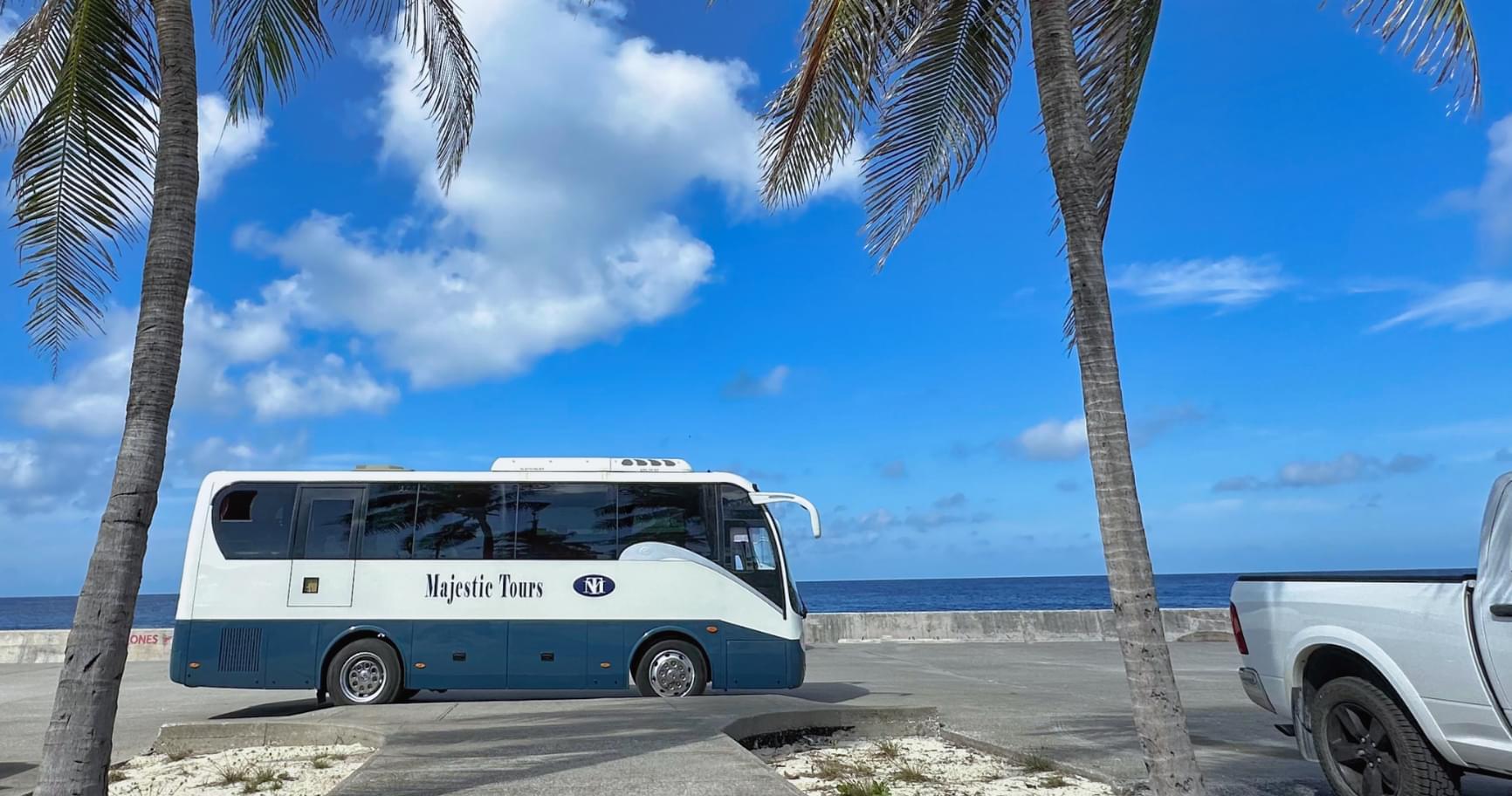 Shuttle bus parked near Seven Mile Beach, a convenient choice for shore excursions in Grand Cayman
