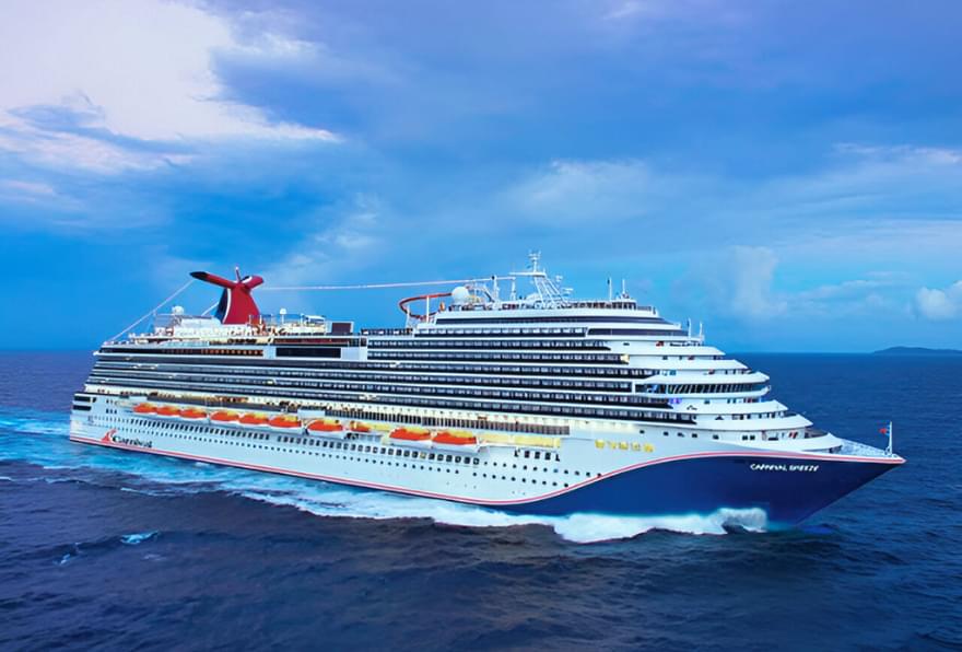 Carnival Cruise ship near the island, perfect for planning grand Cayman excursions for carnival