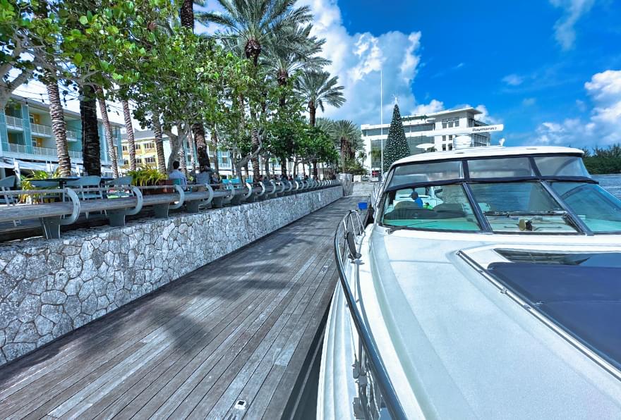Wooden boardwalk at Camana Bay, a picturesque location for boat departures