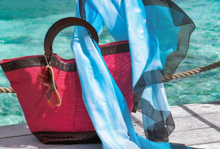 Elegant tote bag on a boat deck, capturing the vibe of Cayman Islands luxury