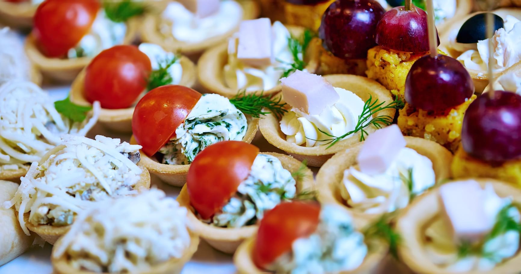 Gourmet appetizers served onboard, elevating the dining experience on a luxury yacht