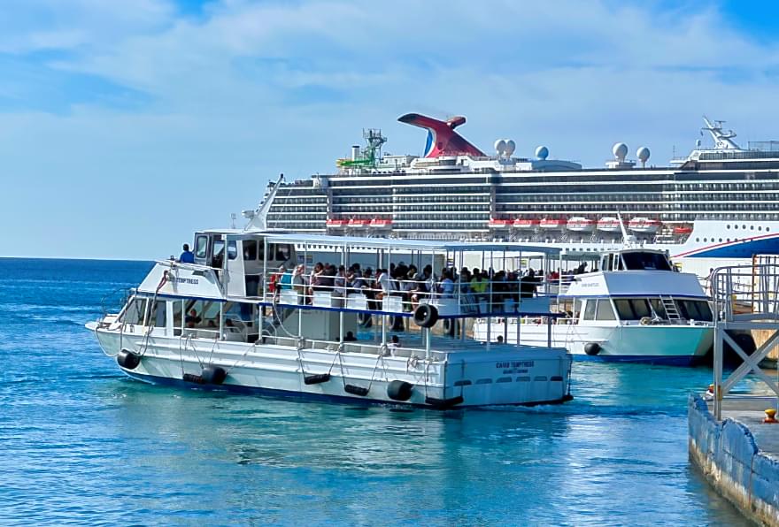 Cruise ship docked, a reminder for passengers to plan their return timely
