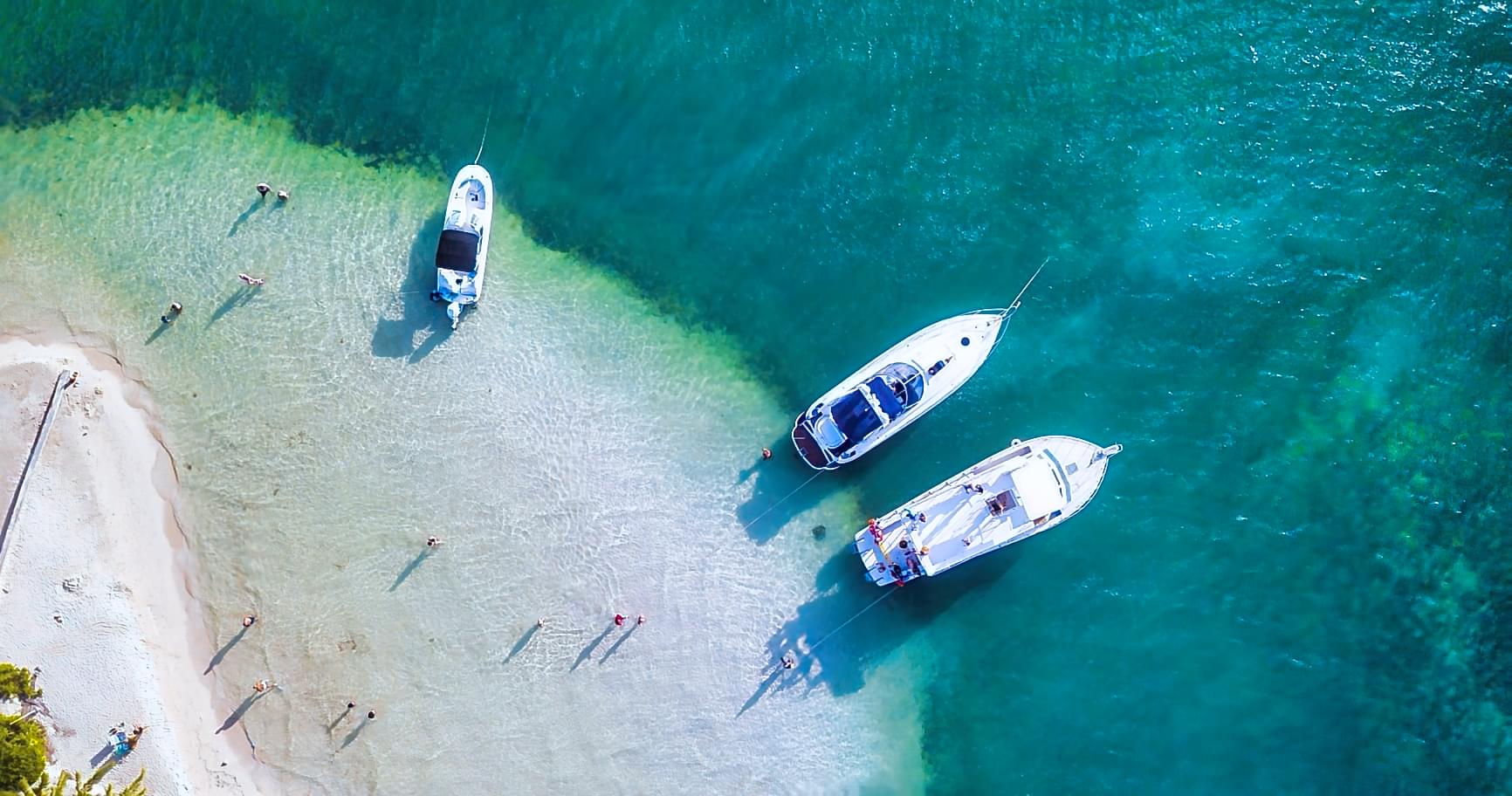 Secluded beach accessible by boat, emphasizing Cayman boat rentals for private adventures