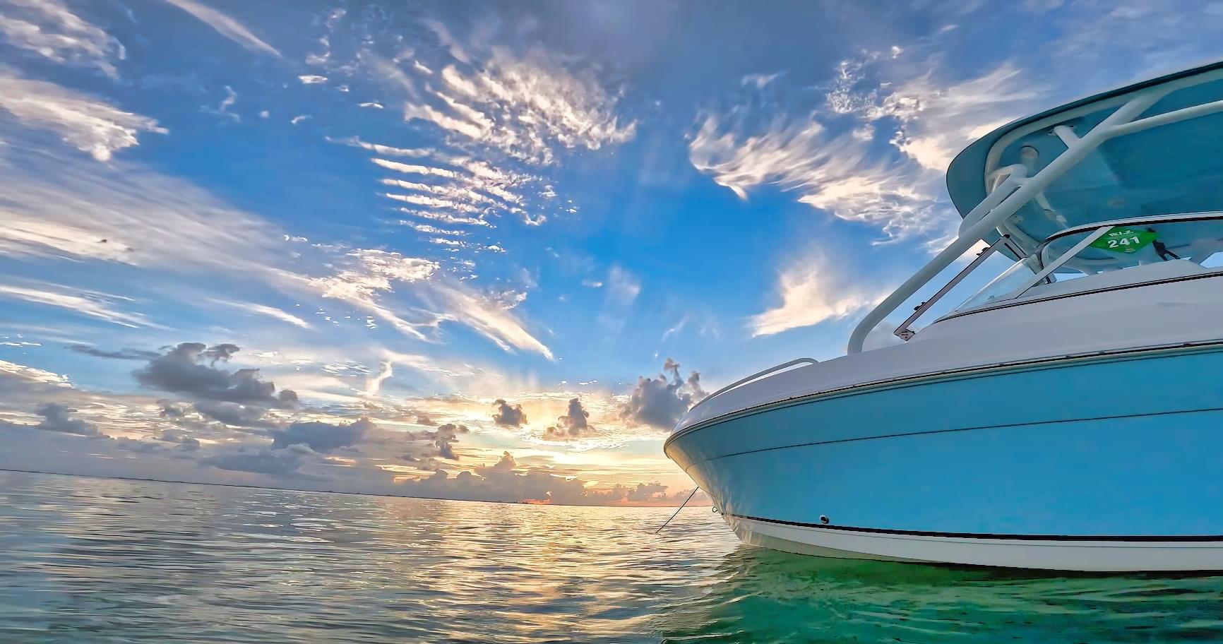Sunset reflecting on calm waters during a private charter trip