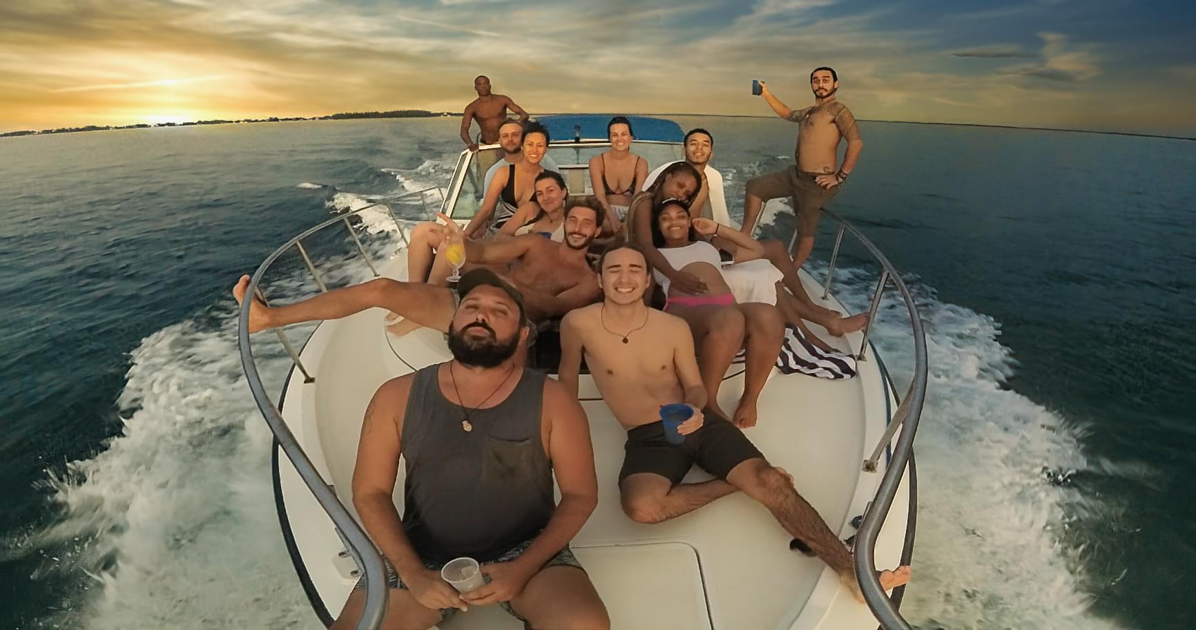Friends having fun on a private boat rental, showcasing the beauty of boats for hire Grand Cayman