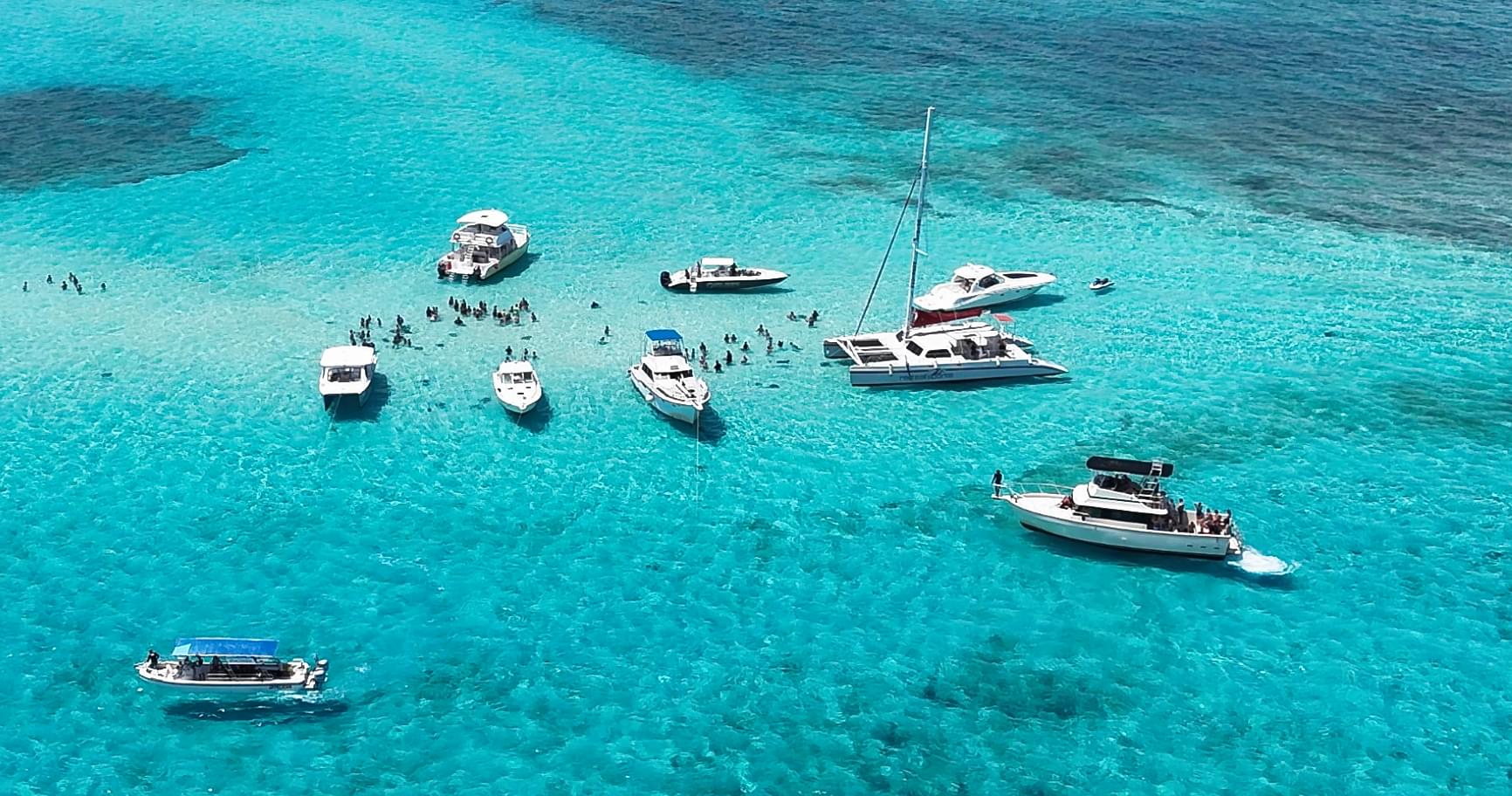Aerial view of boats at stingray city tours and the shallow sandbars in Grand Cayman