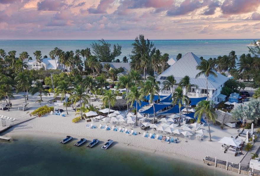 Aerial view of Kaibo Beach Bar, showcasing its serene beachfront and dining area in Grand Cayman