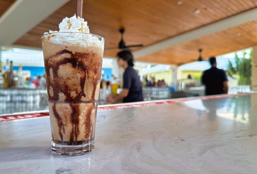 Iconic Mudslide cocktail at the Rum Point Bar, a must-try tropical treat