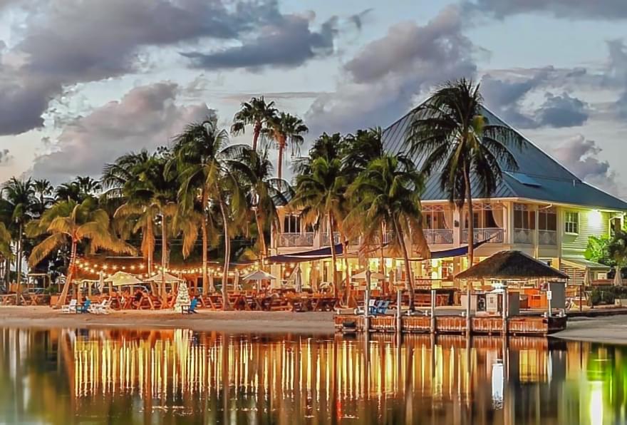 Evening ambiance at Kaibo Beach Bar, surrounded by tropical scenery in Grand Cayman