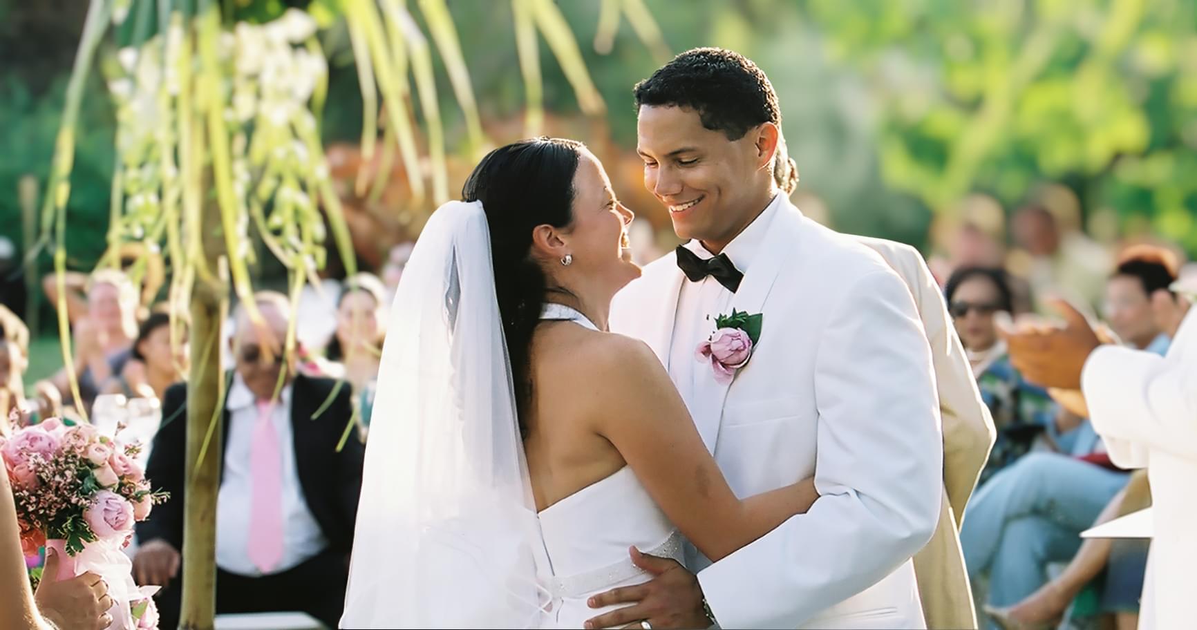 Bride and groom exchanging vows during a Cayman Islands wedding ceremony