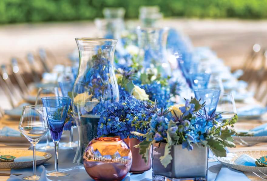 Stunning floral decor at a reception under clear Cayman skies