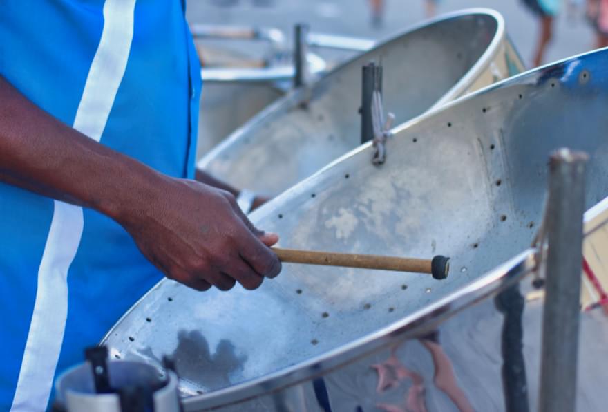 Local musician playing steel drums, adding island rhythms to a Cayman wedding celebration