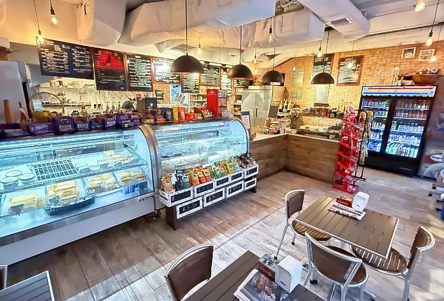 Petit Paris bakery at Camana Bay, offering freshly baked French pastries and coffee.