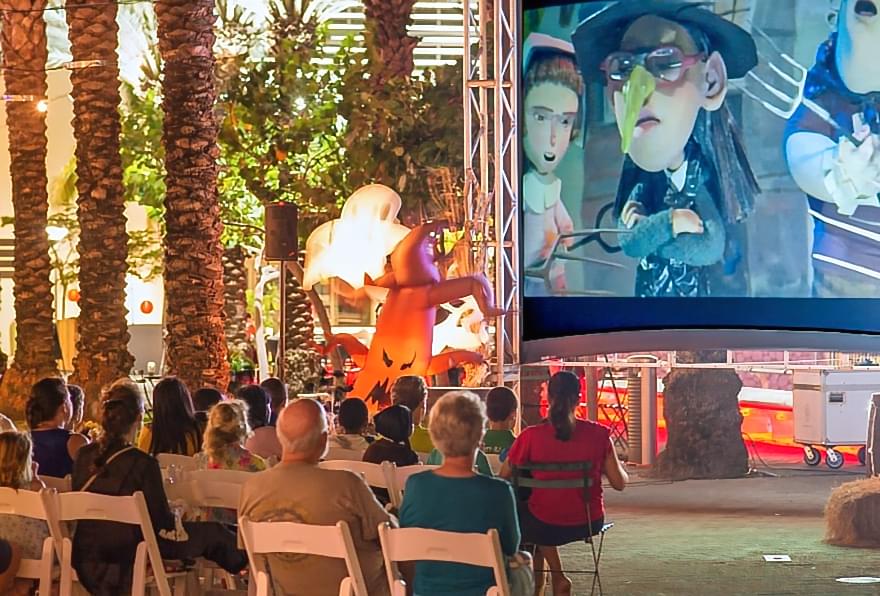 Outdoor movie night event at Camana Bay, showcasing community entertainment options.