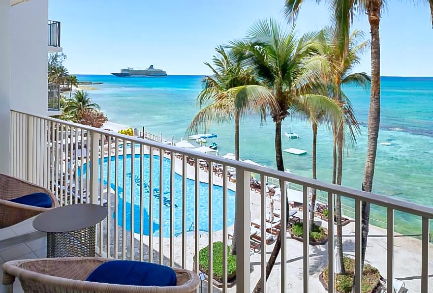 Private balcony with ocean views at a hotel near Camana Bay