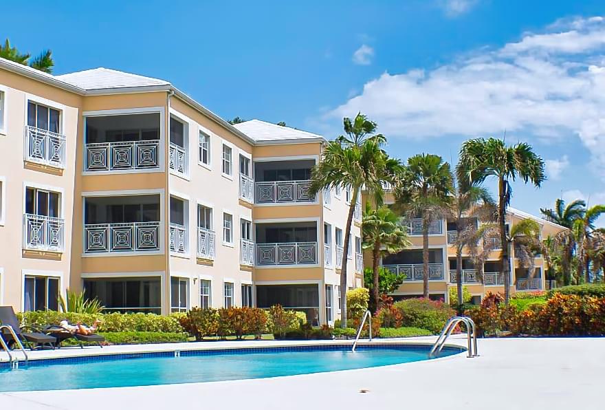 Regal Beach Club near Camana Bay, offering family-friendly beachfront condos