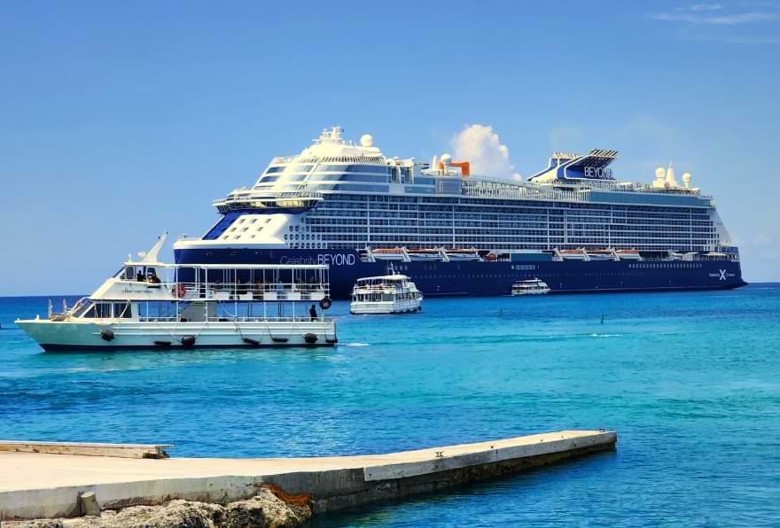Cruise ship docked near the Grand Cayman cruise port, highlighting popular cruises