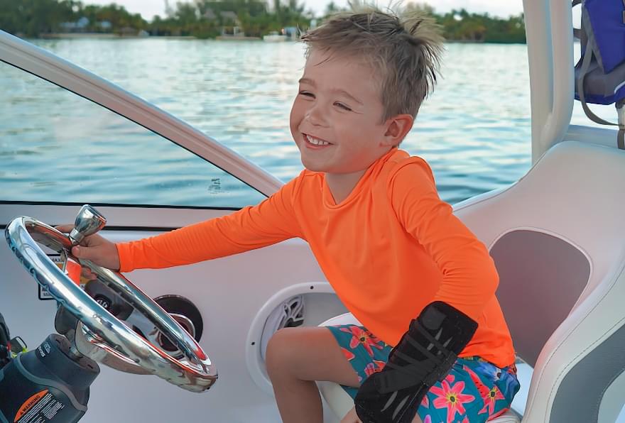 Child pretending to be a captain on a fun boat adventure